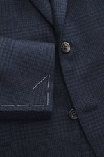 Close-up front view of Canali Blazer navy/black checked in pure wool with Prince-of-Wales pattern, soft touch, slim fit, tailored two-button style, notched lapel, classic breast pocket, hip flap pockets, unfinished sleeve cuffs, rear vents, unconstructed 