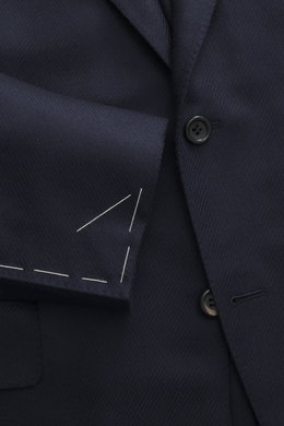 Close-up front angle of Canali Blazer navy showing wool with silk fabric in tonal woven pattern, soft touch, slim fit, tailored two-button style, notched lapel, classic breast pocket, hip pockets with flap, unfinished sleeve cuffs, rear side vents, uncons