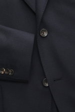 Agnona Cashmere Blazer dark navy melange close-up from front showing pure cashmere fabric, very soft touch, slim fit, tailored two-button style, notched lapel, classic breast pocket, patch hip pockets, kissing buttons, rear side vents, unstructured design