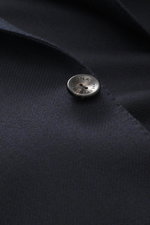 Agnona Cashmere Blazer dark navy melange close-up from front side showing pure cashmere fabric, very soft touch, slim fit, tailored two-button style, notched lapel, classic breast pocket, patch hip pockets, kissing buttons, rear side vents, unstructured d