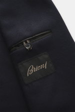 Close-up front pocket view of Brioni Jersey blazer navy in finest cashmere and silk jersey, slim fit, unconstructed design with logo patch.