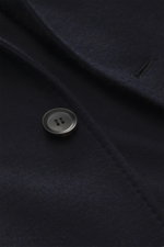 Close-up front view of Brioni Jersey blazer navy showing soft cashmere and silk fabric, button, and detailed stitching.