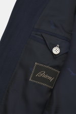Close-up interior view of the Brioni Blazer 'Ravello' navy showing fine herringbone wool-cashmere fabric, branded lining, and button details.