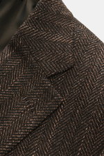 Close-up front angled view of Brioni Blazer 'Ravello' dark brown/brown patterned showcasing Italian craftsmanship in wool-silk herringbone weave.

Additional description: 
<p>Italian craftsmanship in its finest form: The 'Ravello' model by BRIONI impresse