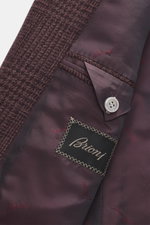 Close-up inside view of the Brioni Blazer 'Ravello' mauve checkered showing fine wool and silk blend, smooth lining, button, and branded label.