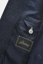 Close-up interior view of the Brioni Blazer 'Ravello' navy checkered showing navy branded lining, inner pockets, and wool-silk fabric texture.