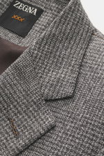 Nahaufnahme des Zegna Sakko 'Couture' anthrazit/grau kariert, zeigt Glencheck-Muster, fallendes Revers und Zegna-Label innen.
