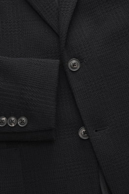 Nahaufnahme von Circolo 1901 Strickblazer dark navy, Slim Fit, tailliert mit markantem Prince-of-Wales Muster aus Woll-Mix, von vorne fotografiert.