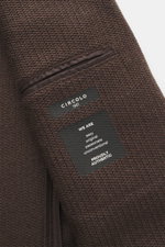 Circolo 1901 Strickblazer dunkelbraun in Nahaufnahme von innen, Woll-Mix mit markantem Strick und Innentasche sichtbar.