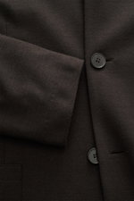 Close-up front view of Harris Wharf London Jersey jacket dark brown showing button and sleeve detail in soft, lightweight virgin wool.

Description: 
<p>The elegant look of a smart-casual jacket meets the comfort of a sweat jacket – HARRIS WHARF LONDON ha