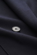 Close-up front view of Harris Wharf London Jersey blazer navy showing soft virgin wool jersey fabric and a silver button in slim fit double-breasted style.