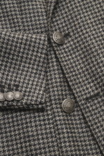 Close-up front view of Santaniello Beige/anthracite patterned blazer showing houndstooth weave, crest buttons, classic breast and patch hip pockets.

Description: <p>Classically elegant into the new season: This double-breasted blazer with crest buttons f