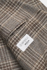 Close-up angled view of Santaniello Beige/Brown Checked Blazer showing wool-cashmere Glencheck pattern, classic breast pocket, and label.

<p>Always well dressed: This elegant blazer by SANTANIELLO made of wool with cashmere and a classic check pattern re