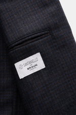 Close-up view of Santaniello Blazer navy/dark brown checked pure wool fabric with classic breast pocket and label, showing soft touch and check woven pattern.