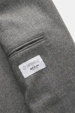 Close-up of the Santaniello Blazer grey melange pocket and label, photographed from a top-down perspective, showing pure wool fabric, soft touch, and tailored details.