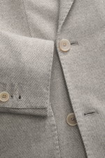 Santaniello Blazer grey/offwhite striped close-up from front top showing fine wool fabric, buttons, peak lapel, and sleeve cuff details. Classically elegant into the new season: This double-breasted blazer by SANTANIELLO made of fine wool with cashmere is