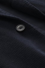 Close-up front view of the Santaniello Cord Blazer navy showing soft corduroy fabric, a black button, and detailed stitching.

Description: Always well dressed: This cord blazer by SANTANIELLO made of soft cotton with cashmere reliably accompanies you thr