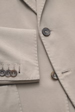 Close-up front detail of the Santaniello Taupe Blazer, showing buttons, notched lapel, and fabric texture from a top-down perspective.

<p>Modern tailoring for the transitional season: The blazer by SANTANIELLO complements numerous looks with its relaxed 