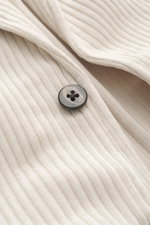 Close-up front angle of the 04651/ A trip in a bag Cord Blazer sand showing corduroy made of high-quality microfiber with light elastic quality, slim fit, tailored two-button style, notched lapel, patch hip pockets, small woven label in side seam, rear si