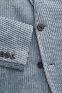 Close-up front view of 04651/ A trip in a bag Cord Blazer Smoke Blue showing cord microfiber fabric, slim fit, tailored two-button style, notched lapel, patch hip pockets, small woven label in side seam, rear side vents, sleeve cuffs with buttons, unconst