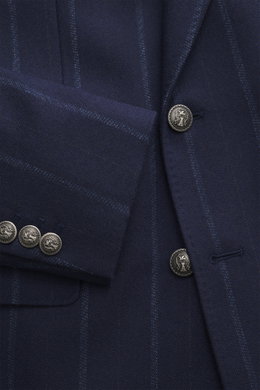 Close-up front view of Brunello Cucinelli Navy striped blazer in virgin wool and cashmere blend, soft touch, slim fit, double-breasted three-button style with peak lapels, classic breast pocket, hip pockets with flap, small ticket pocket, unfinished sleev