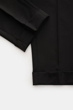 Marco Pescarolo Woll-Jogpants 'Caracciolo' schwarz, Detailaufnahme von fixiertem Saumaufschlag und schmal zulaufendem Bein aus leicht elastischer Schurwolle.
