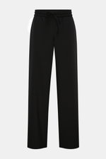 Ami Paris Jogger pants black shown from the front on a plain background, featuring a high waist, elasticated waistband with drawstring, zip and waist button, French pockets, patch back pockets, slight taper, loose fit in pure virgin wool. Trendy oversized