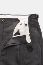 PT Torino Wool trousers 'Gentleman Fit' dark grey mottled shown from a top-front close-up with open zipper, buttons, and side adjuster visible. For the exclusive trousers 'Gentleman Fit', PT TORINO has chosen virgin wool in lightweight Super 130'S fabric 