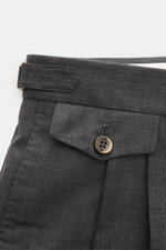 Close-up view from above of the waistband and upper front section of PT Torino Wool trousers 'Gentleman Fit' dark grey mottled, showing side adjuster, double pleat, and buttoned watch pocket flap, made of pure Super 130'S virgin wool, soft feel, lightweig