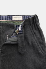 Close-up front view of Jacob Cohen Wool pants 'Jannik' dark grey melange showing open zipper, waistband details, and striped inner lining, crafted from slightly elastic wool with slim tapered fit.