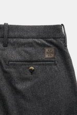 Close-up rear view of Jacob Cohen Wool Trousers 'Bobby' Dark Grey Mélange showing slightly elastic wool fabric, welted back pocket with button, small calf leather patch, belt loops; precise Italian craftsmanship in a straight regular fit.