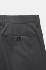 Close-up rear view of Berwich Wool Pants 'Retrolong' dark grey melange showing welt back pocket with button, waistband, and belt loops.