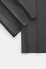 Close-up front view of Berwich Wool Pants 'Retrolong' dark grey melange fabric showing fine twill, soft touch, and open hem.
