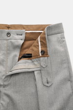 Berwich Wool Pants 'Chiaia' Grey Mélange shown from above with open waistband, zipper, button tab, and visible brown interior lining. The wool pants 'Chiaia' by BERWICH impress with a modern tapered fit, slightly elastic virgin wool, and stylish lines – a