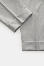 Close-up view of Berwich Wool Pants 'Chiaia' Grey Mélange showing tapered ankle-length leg with fixed hem cuff and smooth virgin wool fabric.