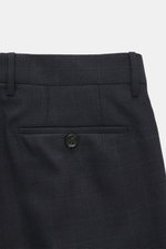 Close-up back view of Berwich Wool pants 'Retrolong' navy checkered with piped welt pocket, button, and fine twill wool fabric.