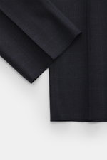 Berwich Wool pants 'Retrolong' navy checkered close-up showing fabric texture and open hem from top-down angle, pure wool twill.