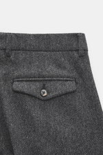 Close-up rear view of Berwich Merino Wool Pants 'Negroni' dark grey patterned, showing herringbone pure wool fabric, flap back pocket with button, and waistband details.

Additional description: <p>The wool pants 'Negroni' by BERWICH are made from pure wo