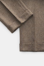 Close-up top-down view of Berwich Merino Wool Pants 'Negroni' brown patterned with soft herringbone wool fabric and fixed hem cuffs.