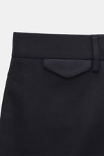 Santaniello Trousers 'Cava' navy close-up front view showing waistband, button, belt loop, and flap pocket in a soft wool blend fabric.