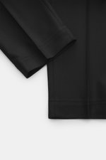 Santaniello Hose 'Cava' schwarz aus Woll-Mix, weicher Griff, Tapered Fit, knöchellang, Detailaufnahme des Saums aus seitlicher Perspektive.