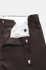 Close-up view of Lardini Trousers dark brown showing open waistband with zipper and hook, pure viscose, regular fit, straight cut, French pockets, small watch pocket, and piped back pockets with button, open length.