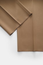 Close-up image of the hem and fabric texture of Lardini Trousers brown, photographed from a top-down perspective, made of pure viscose, regular fit, straight cut, with zipper and waistband hook, French pockets, small watch pocket, piped back pockets with 