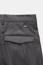 PT Torino Wool trousers 'Master Fit' dark grey shown from a close-up rear view, highlighting the fixed hem cuff, French pockets, back pockets with concealed buttoned flap, zipper, and waistband hook. Confident style for the office: The 'Master Fit' trouse