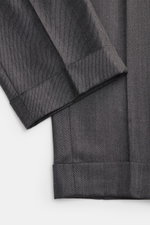 PT Torino Wool trousers 'Master Fit' dark grey shown up close from above, highlighting the fixed turn-up cuff and twill fabric.