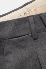 Close-up front top view of PT Torino Wool Pants 'Rebel Fit' dark grey, elastic virgin wool with tapered fit, single waistband pleat, and belt loops.