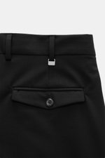 PT Torino Wool Pants 'Rebel Fit' Black shown from a close-up rear perspective, highlighting back pocket with flap and button, belt loops with small metal initial. With PT TORINO, you are always on the right track: These comfortably cut pants in the trendy