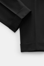 PT Torino Wool Pants 'Rebel Fit' Black shown from a close-up side angle, highlighting the ankle-length tapered fit, fixed hem cuff, and fine textured elastic virgin wool fabric. With PT TORINO, you are always on the right track: These comfortably cut pant