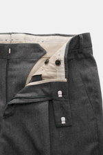 PT Torino Pants 'Rebel Fit' dark grey patterned shown close-up from above, highlighting zipper, waistband hook, and fine herringbone cotton-wool fabric.