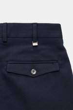 Close-up rear view of PT Torino Pants 'Rebel Fit' navy patterned, showing fine herringbone cotton-wool fabric, flap back pocket with button, belt loops with metal PT initial.